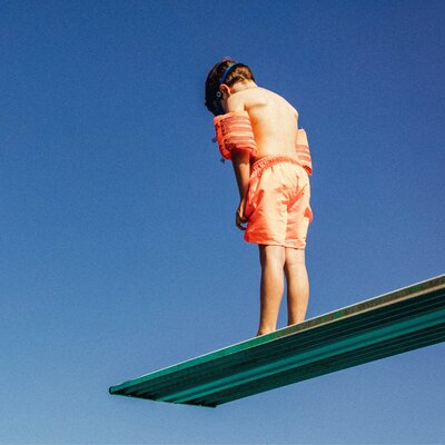 Boy on a diving board