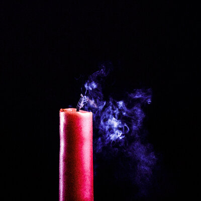 Man with blown out candle